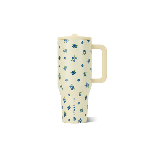 Cream-colored mug with blue floral pattern on a white background