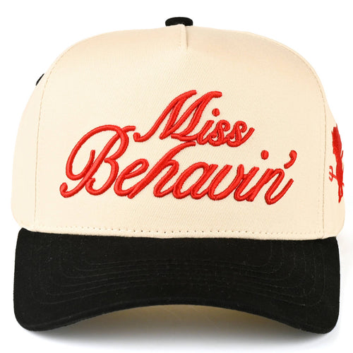 Beige and black cap with red text 'Miss Behavin'' on a white background