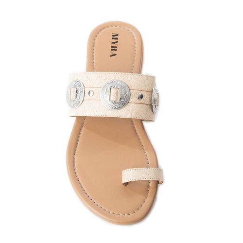 Beige sandal with decorative straps on a white background