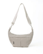 Polka dot handbag with a strap on a white background