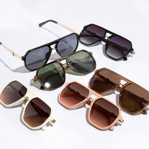 Collection of sunglasses with different frame colors and lens shades on a white background