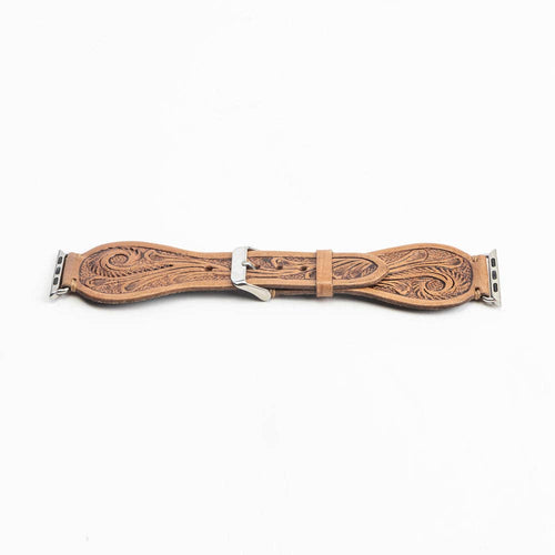 Decorative leather strap with intricate patterns on a white background