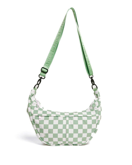 Green and white checkered bag with a strap on a white background
