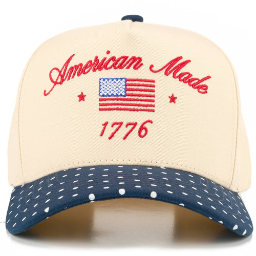 Cap with 'American Made 1776' text and American flag on a beige and navy background