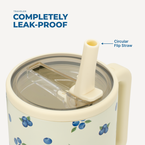 Travel mug with floral design and circular flip straw on a white background