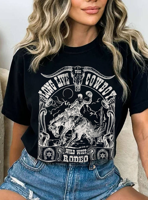 Person wearing a black t-shirt with a graphic design of a cowboy on a horse.