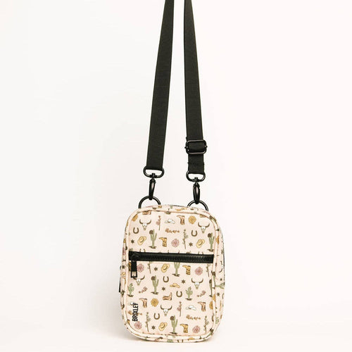 Small crossbody bag with cactus pattern on a white background
