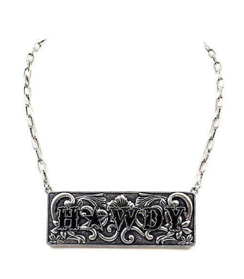Silver necklace with 'HOWDY' pendant on a white background