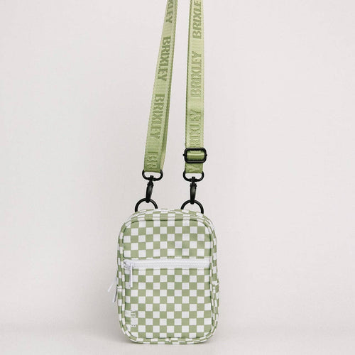 Green checkered bag with a strap on a light gray background