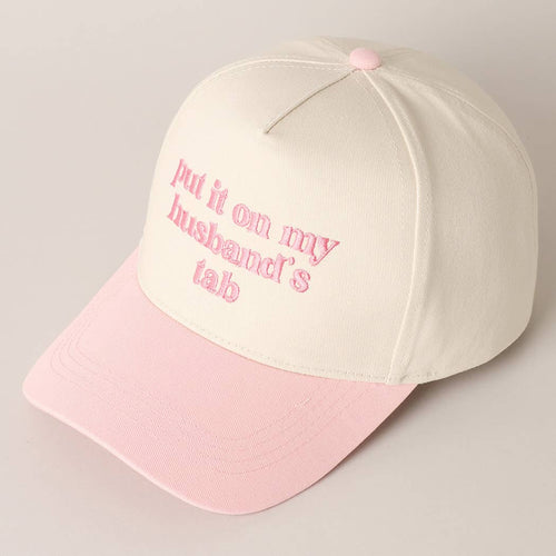 Pink and beige cap with text on a light gray background