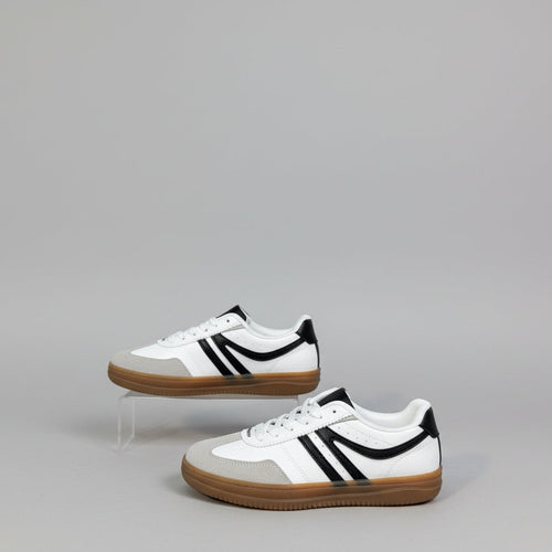 White sneakers with black and tan accents on white background 