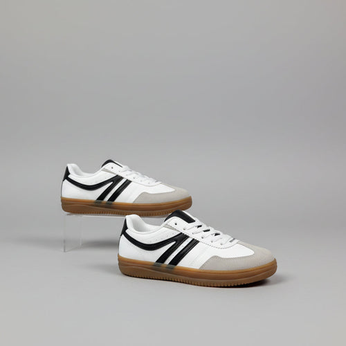 White sneakers with black and tan accents on white background 