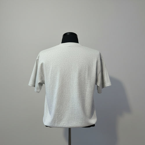 Gray t-shirt on a mannequin against a white background