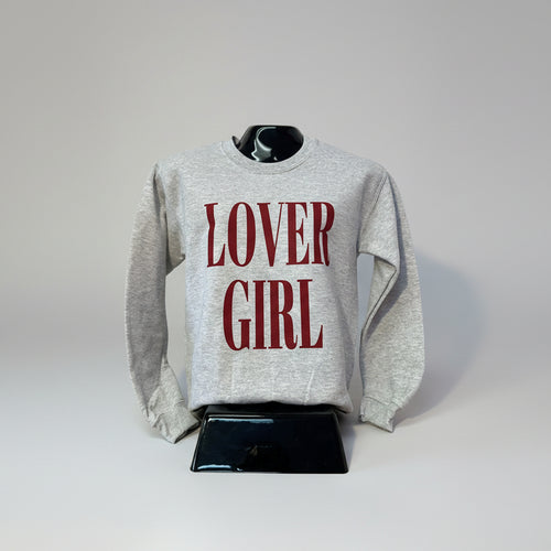 Gray sweatshirt with 'LOVER GIRL' text on a mannequin against a plain background