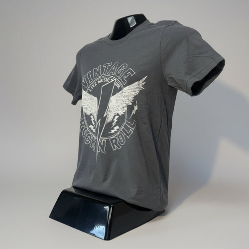 Gray t-shirt with graphic design on a mannequin against a white wall.