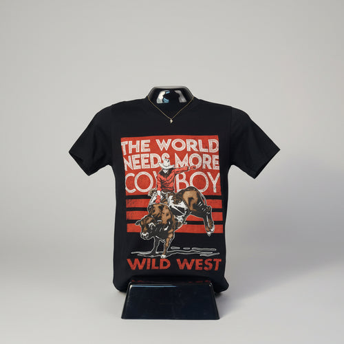 Black t-shirt with a graphic of a cowboy riding a bull and text 'The World Needs More Cowboy Wild West' on a white background. 