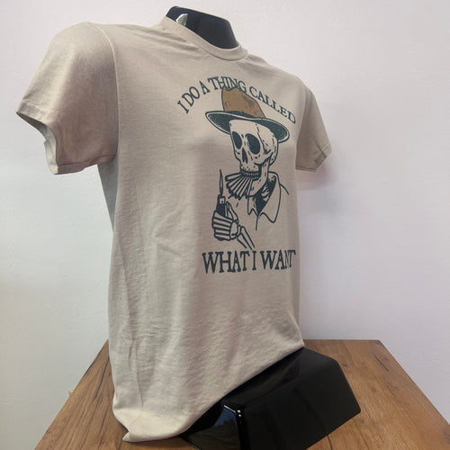 Beige t-shirt with graphic design on a wooden surface