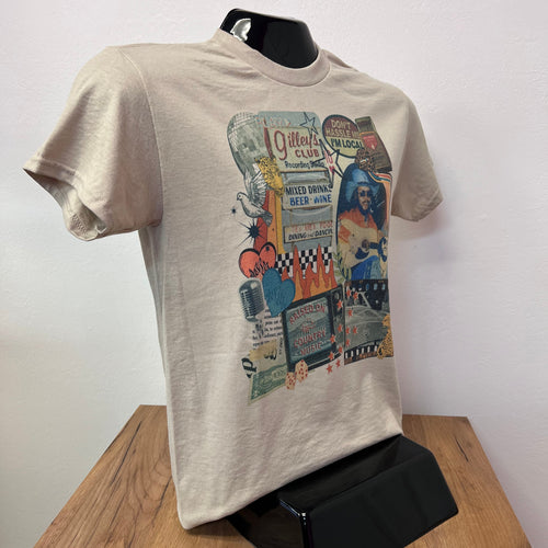 Beige t-shirt with colorful graphic design on a wooden table