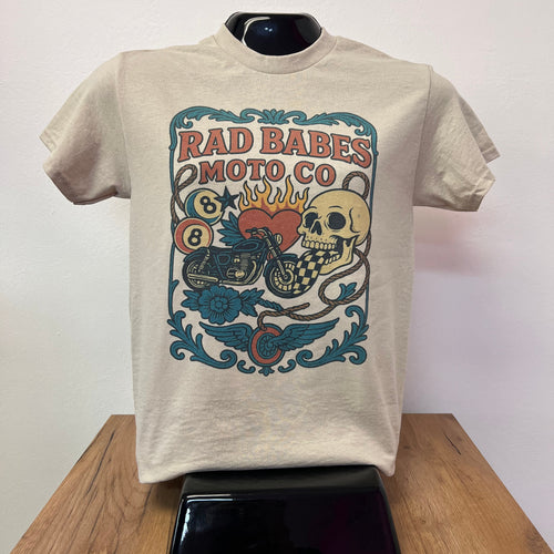 Beige t-shirt with colorful graphic design on a white surface