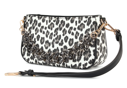 A leopard print wristlet clutch bag with a black leather strap, a decorative black chain detail, and gold-tone hardware, shown on a plain white background.