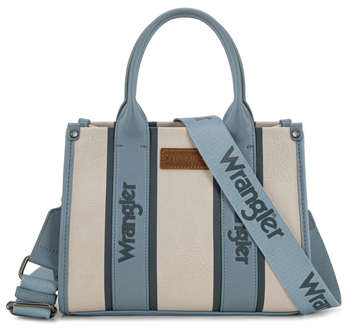 Wrangler structured tote bag in cream and dusty blue faux leather, featuring vertical stripe panels, top handles, a matching blue shoulder strap with 'Wrangler' text, and a small brown leather brand patch.