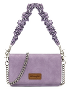 A light purple suede shoulder bag with a patterned purple and white ruffled shoulder strap, a silver chain strap, and a brown leather Wrangler logo patch on the front.