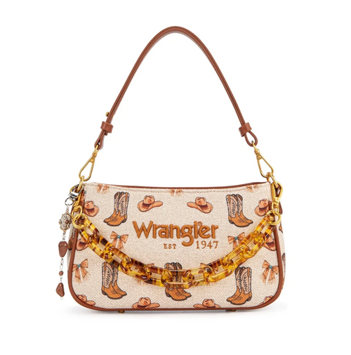 Wrangler handbag with a western boot and cowboy hat pattern on a cream canvas background, featuring a brown leather shoulder strap, gold-tone hardware, and a translucent amber patterned chain.
