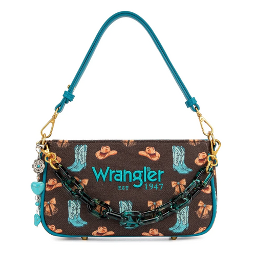 Wrangler shoulder bag featuring a brown coated canvas body with a cowboy hat and turquoise boot pattern, a turquoise leather strap, a chunky black and turquoise chain, and a turquoise heart charm.