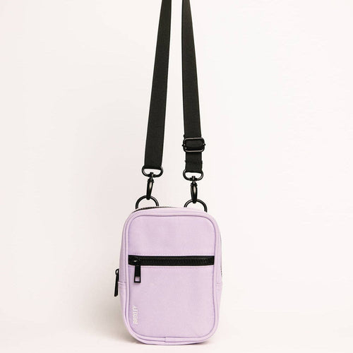 Purple crossbody bag with black straps on a light gray background