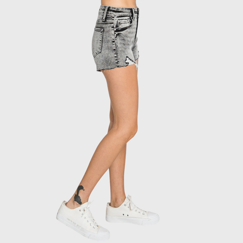 Person wearing gray denim shorts on a white background