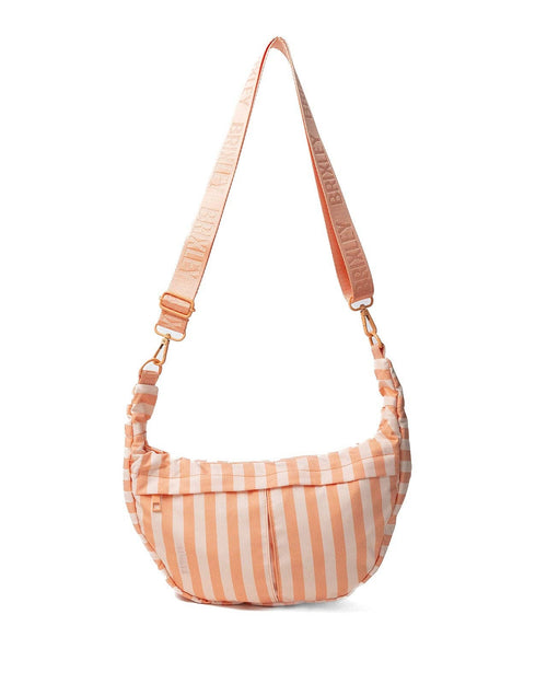 Striped shoulder bag with a pink strap on a white background