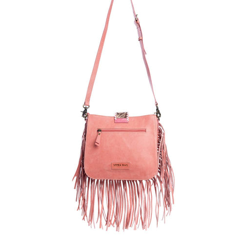 Pink crossbody bag with fringe details on a white background
