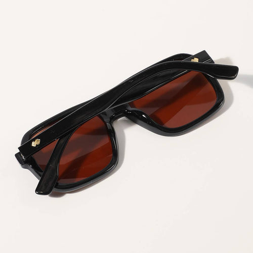 Black sunglasses with red lenses on a white background