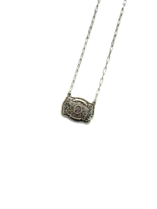 Silver necklace with a decorative pendant on a white background