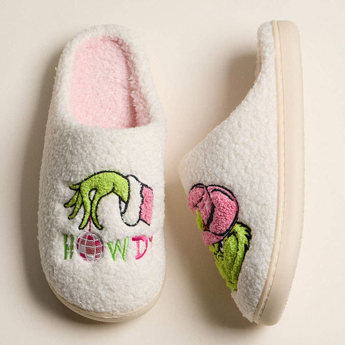 Pair of slippers with embroidered design on a beige background