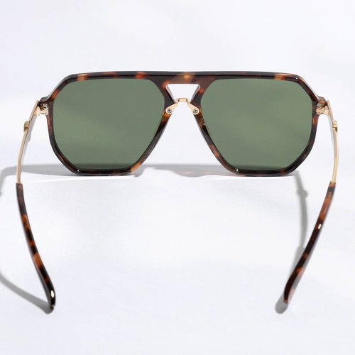 Sunglasses with tortoiseshell frame and green lenses on a white background