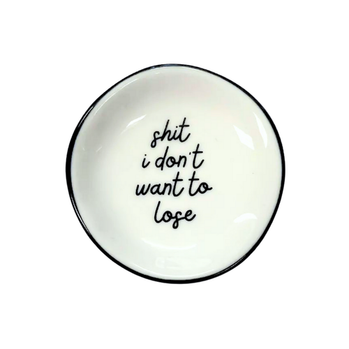 White ceramic plate with black text 'shit i don't want to lose' on a white background