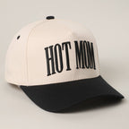 Beige and black cap with 'HOT MOM' text on a light gray background