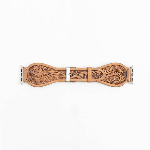 Decorative leather strap with intricate patterns on a white background