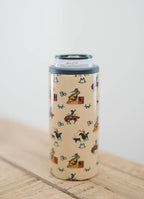 Tumbler with cowboy pattern on a wooden surface
