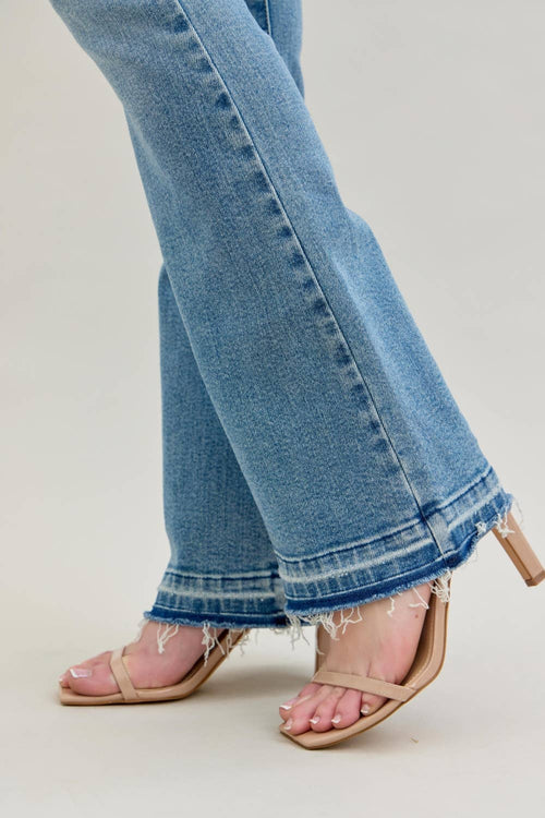 Close-up of blue jeans with a neutral background