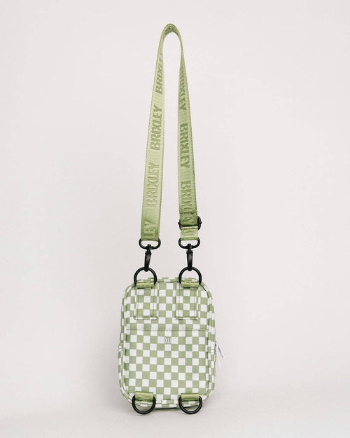 Green checkered pouch with a matching strap on a light gray background