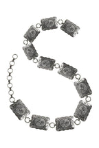 Silver belt  with textured square links on a white background