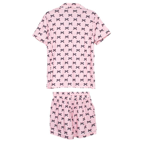 Pink pajama set with black bow pattern on a white background