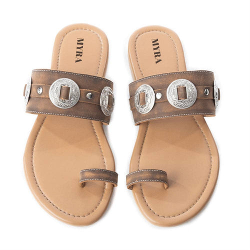 Pair of brown sandals with silver buckles on a white background